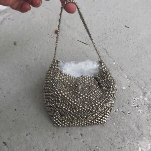 Liquid metal chrome bag by Sergio Gutierrez